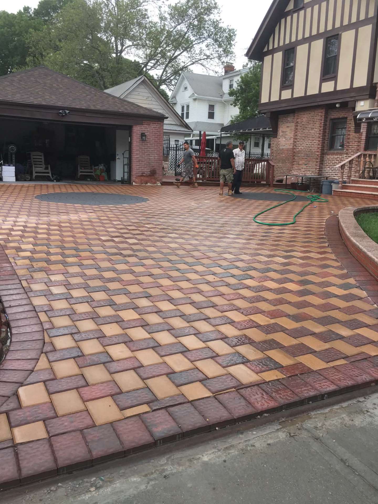 Custom patterned brick paver driveway