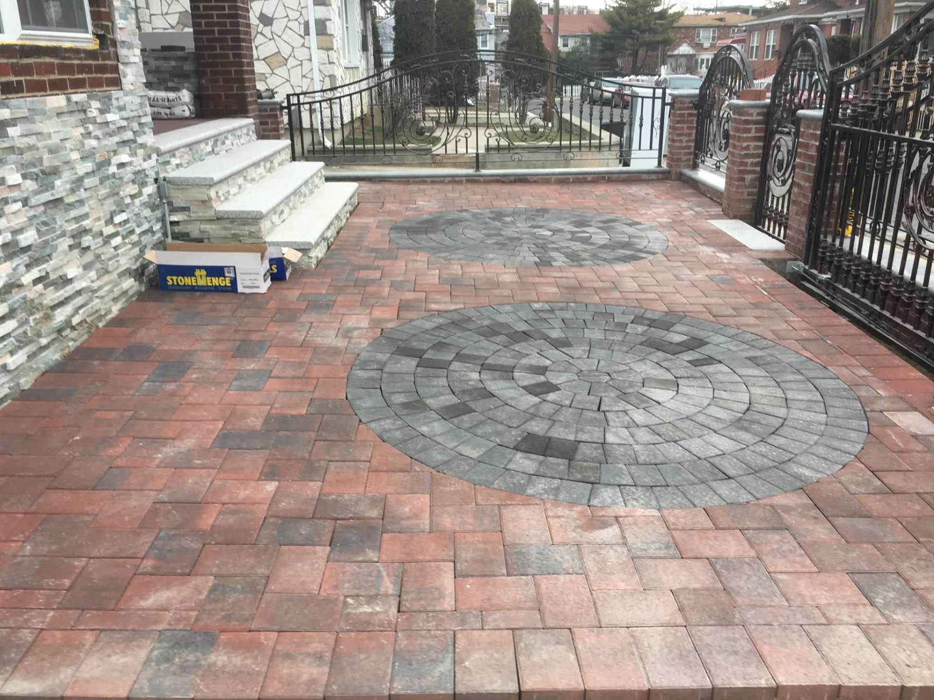 Brick paver patio with circular medallions