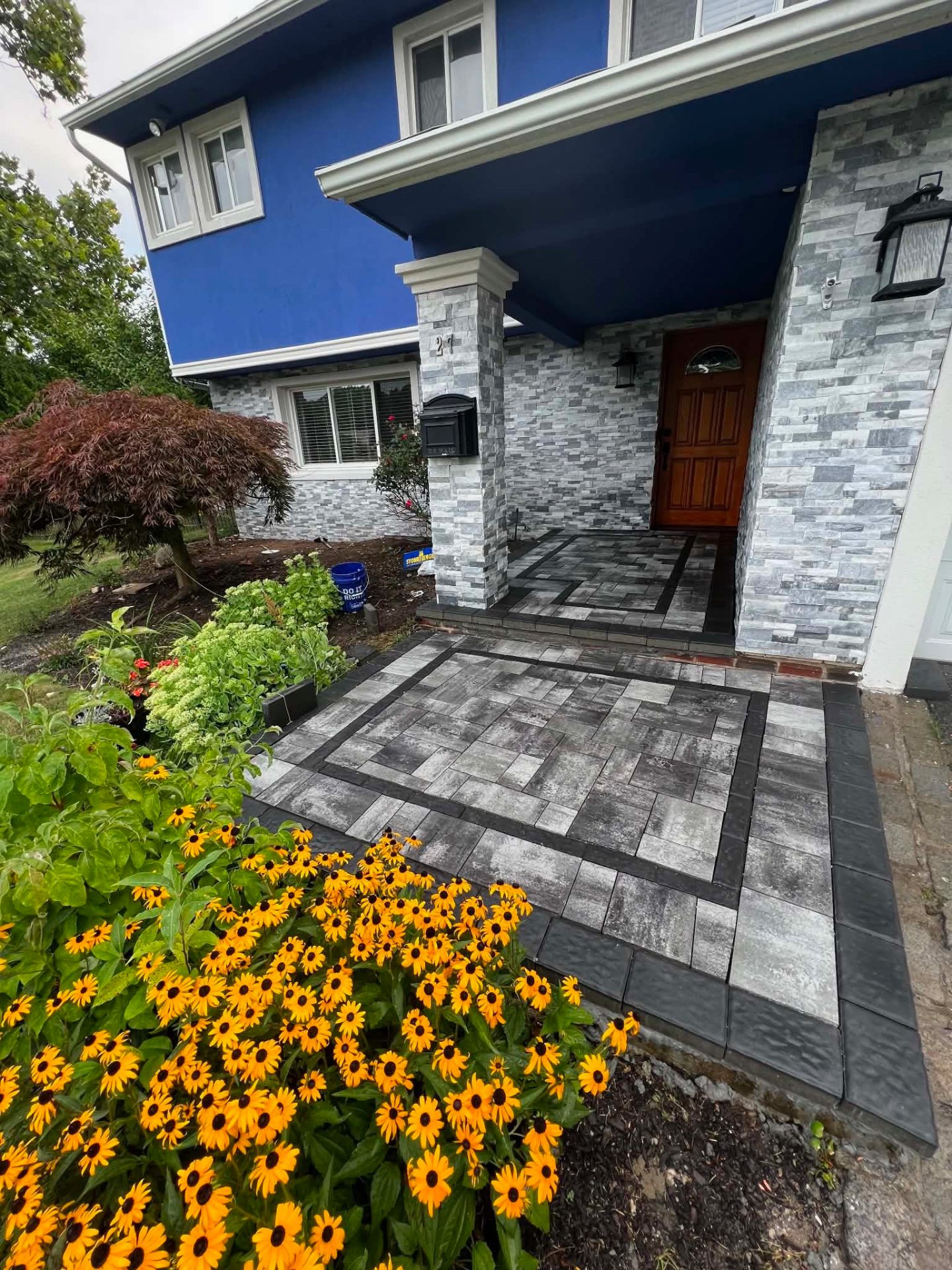 Stone veneer entry with paver walkway